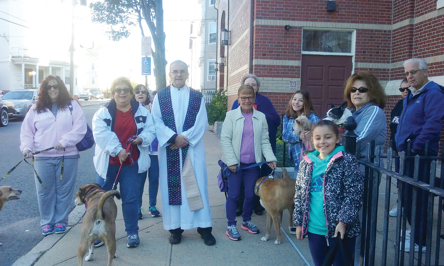 St. Ann Pastor Father Albert Ranallo’s stole was also made by a parishioner. It features multi-colored paw prints, perfect for the occasion. The annual Blessing of the Animals commemorates the feast day of St. Francis of Assisi, patron saint of animals and the environment.